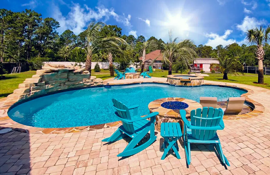 Gunite pool & spa with rock waterfall and fire pit.